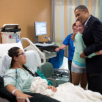President Obama greets a victim of the Aurora shooting