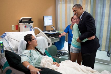 President Obama greets a victim of the Aurora shooting