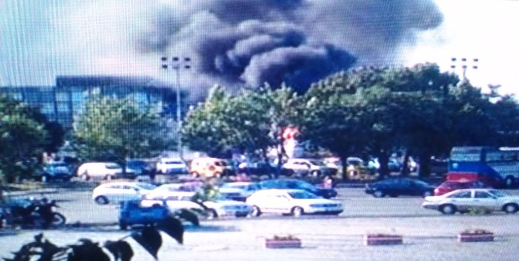 Smoke rising from the bombed bus in Bulgaria