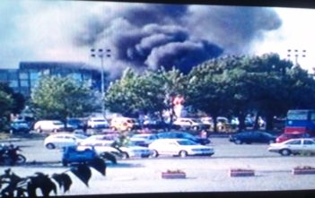 Smoke rising from the bombed bus in Bulgaria