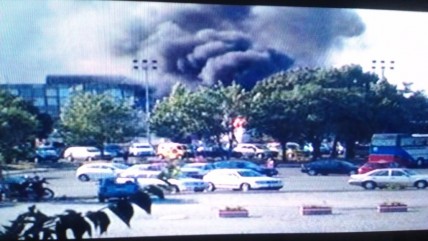 Smoke rising from the bombed bus in Bulgaria