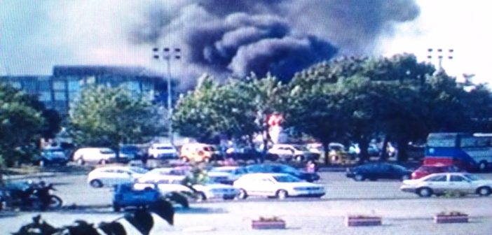 Smoke rising from the bombed bus in Bulgaria