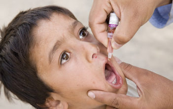 A boy is vaccinated against polio in Afghanistan