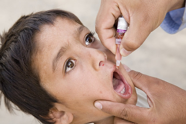 A boy is vaccinated against polio in Afghanistan