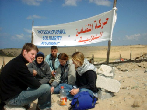 Rachel Corrie (right) defending a Palestinian well