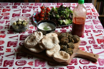 Mezze with falafel, pittas, olives, and salad