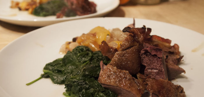 Roast mallard with pancetta and peaches