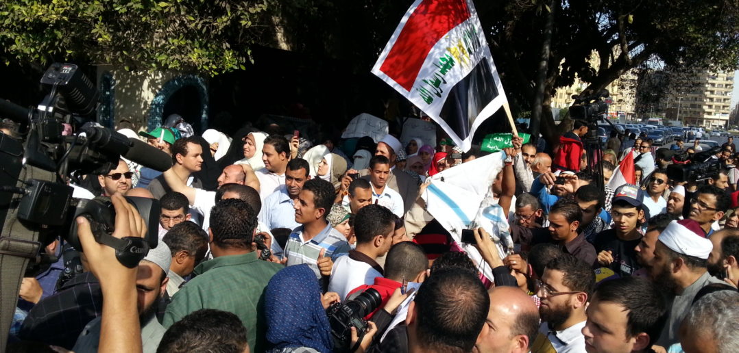 Protesters burn Israeli flag outside the Arab League offices in Tahrir
