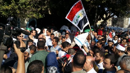 Protesters burn Israeli flag outside the Arab League offices in Tahrir