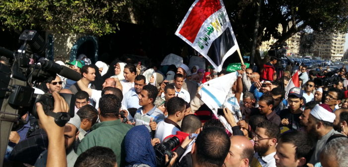 Protesters burn Israeli flag outside the Arab League offices in Tahrir
