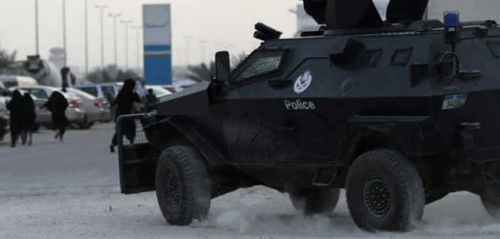 Female protesters flee from armoured police vehicle