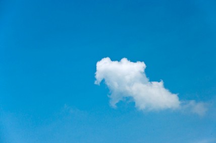 Single white cloud on a clear blue sky