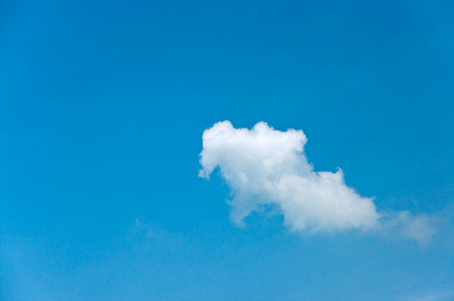 Single white cloud on a clear blue sky