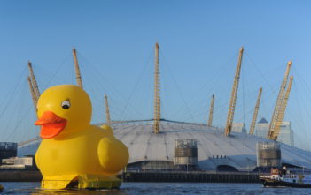 A giant rubber duck floats down the Thames