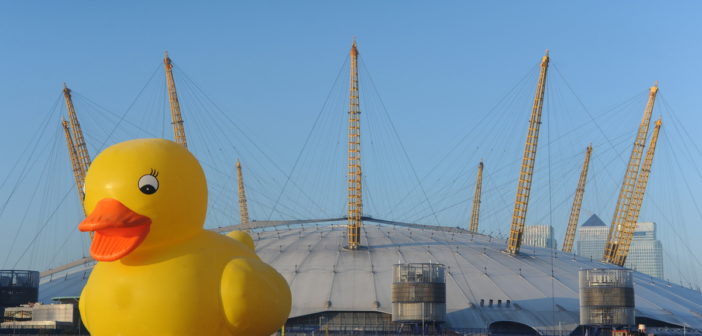 A giant rubber duck floats down the Thames
