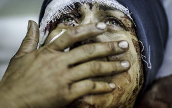 A mother mourns the loss of her family in Syria