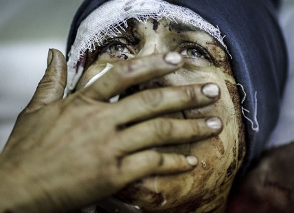 A mother mourns the loss of her family in Syria