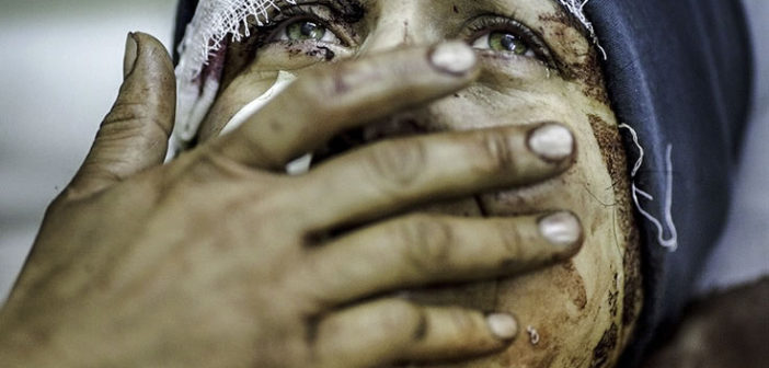 A mother mourns the loss of her family in Syria