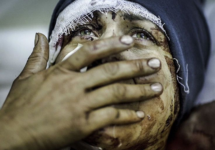 A mother mourns the loss of her family in Syria
