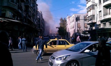 Smoke in old Damascus following double car bomb explosion behind the Justice Palace
