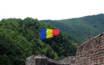Romanian flag flies at Poienari Fort in Romania