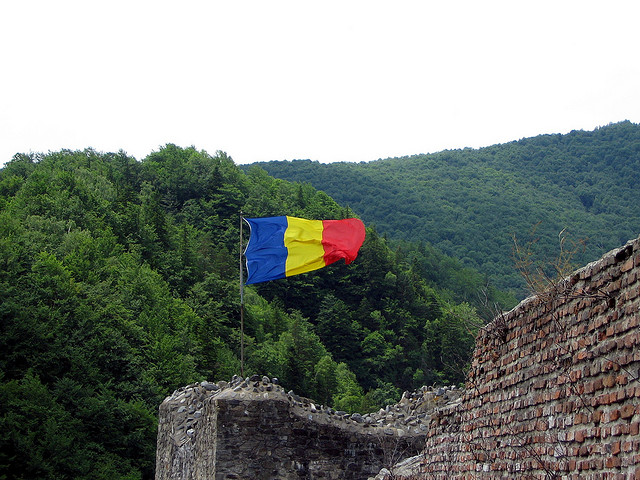Romanian flag flies at Poienari Fort in Romania