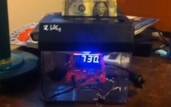 Money shredding alarm clock