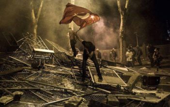 A protester waves the Turkish flag during the demonstrations in Istanbul, Turkey