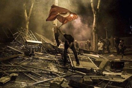A protester waves the Turkish flag during the demonstrations in Istanbul, Turkey