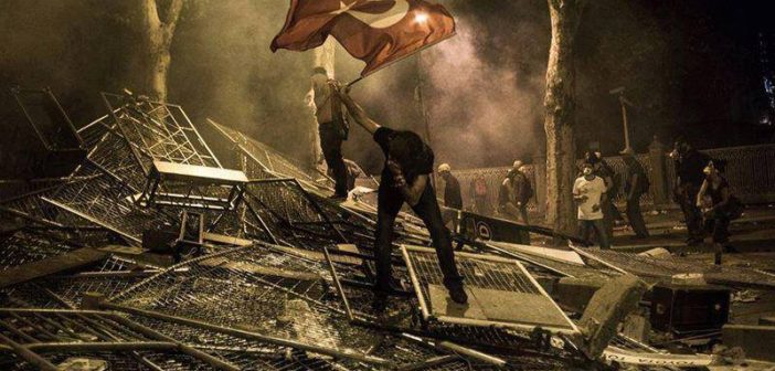 A protester waves the Turkish flag during the demonstrations in Istanbul, Turkey