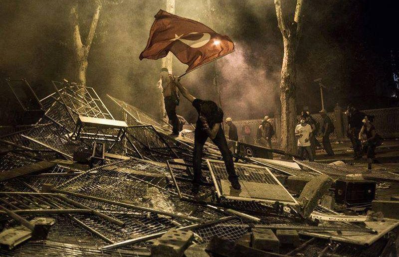 A protester waves the Turkish flag during the demonstrations in Istanbul, Turkey