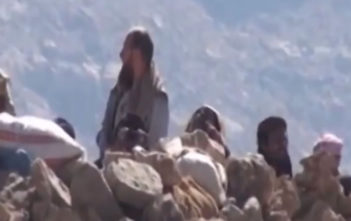 Salafis studying at the Dar Al-Hadith Academy looking beyond the barricades