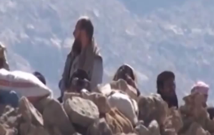 Salafis studying at the Dar Al-Hadith Academy looking beyond the barricades