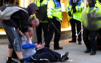 Ian Tomlinson after being pushed to the ground at the G20 protests in 2009
