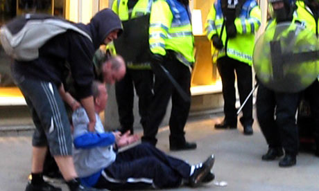 Ian Tomlinson after being pushed to the ground at the G20 protests in 2009