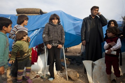 Displaced Syrians at a makeshift camp at Qah in the north of the country