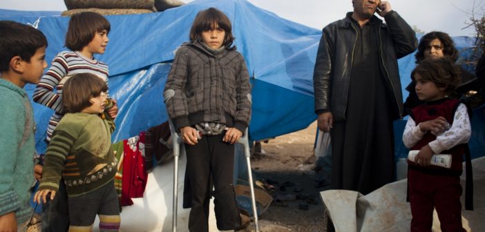 Displaced Syrians at a makeshift camp at Qah in the north of the country