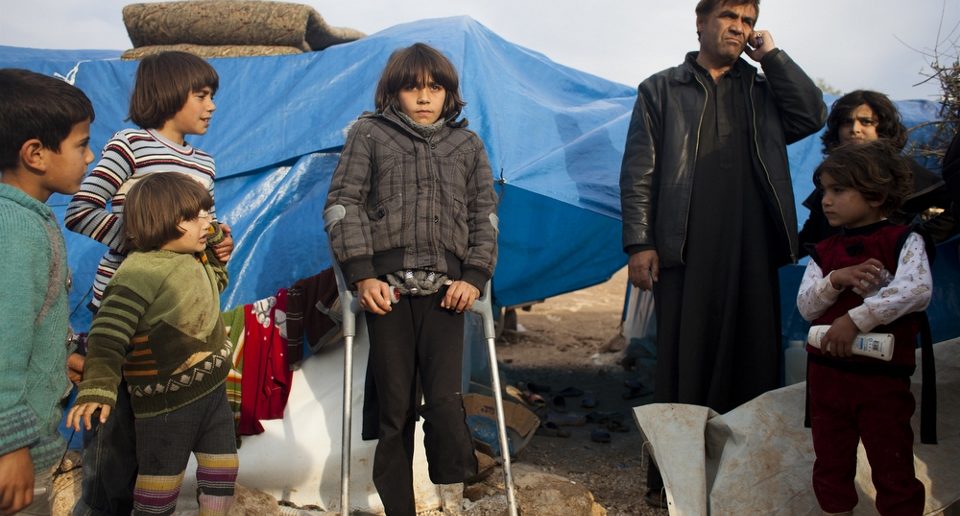 Displaced Syrians at a makeshift camp at Qah in the north of the country