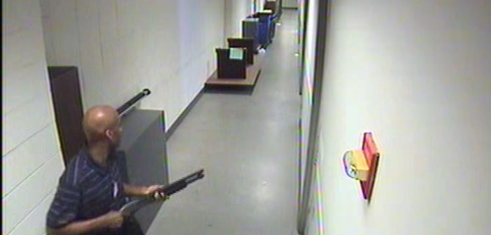 Aaron Alexis seen moving through the hallways of Building #197 carrying the Remington 870 shotgun.