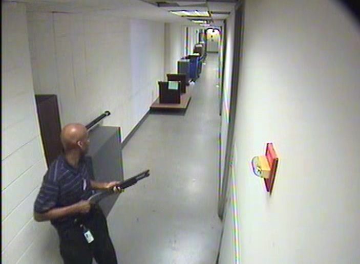 Aaron Alexis seen moving through the hallways of Building #197 carrying the Remington 870 shotgun.