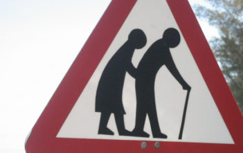 Old people crossing road sign