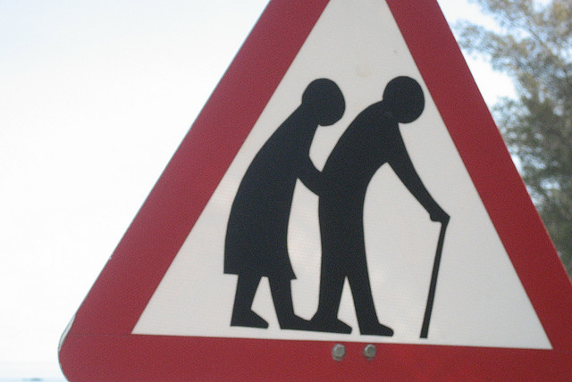 Old people crossing road sign