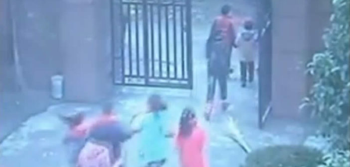 Children flee a man wielding a knife in China