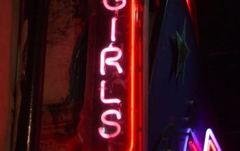 Neon signs for strip clubs in Soho, London