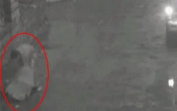 Man forces woman down manhole in China