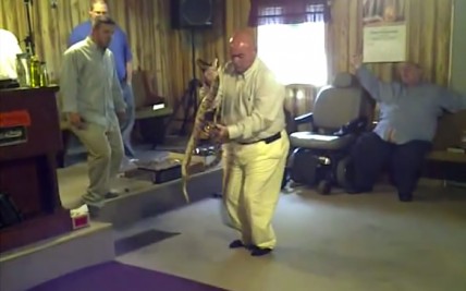 Pastor Coots handling snakes during a service at the Full Gospel Tabernacle In Jesus Name in Middlesboro, Kentucky in 2011