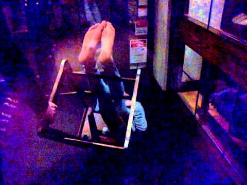 Teenager stuck in high chair