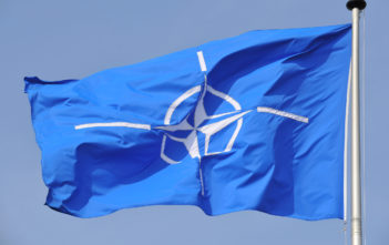 NATO flag flying at NATO Headquarters Brussels.