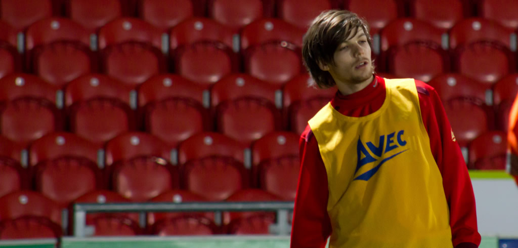 Louis Tomlinson playing football