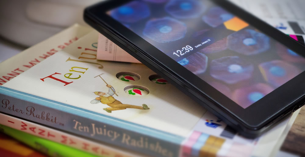 Amazon Kindle Fire e-reader and books